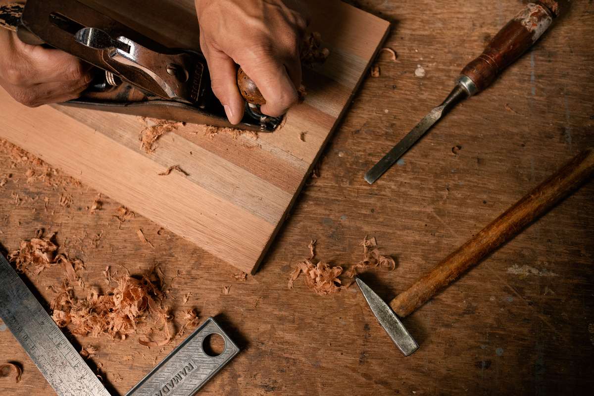 A Person using a Wood Planer